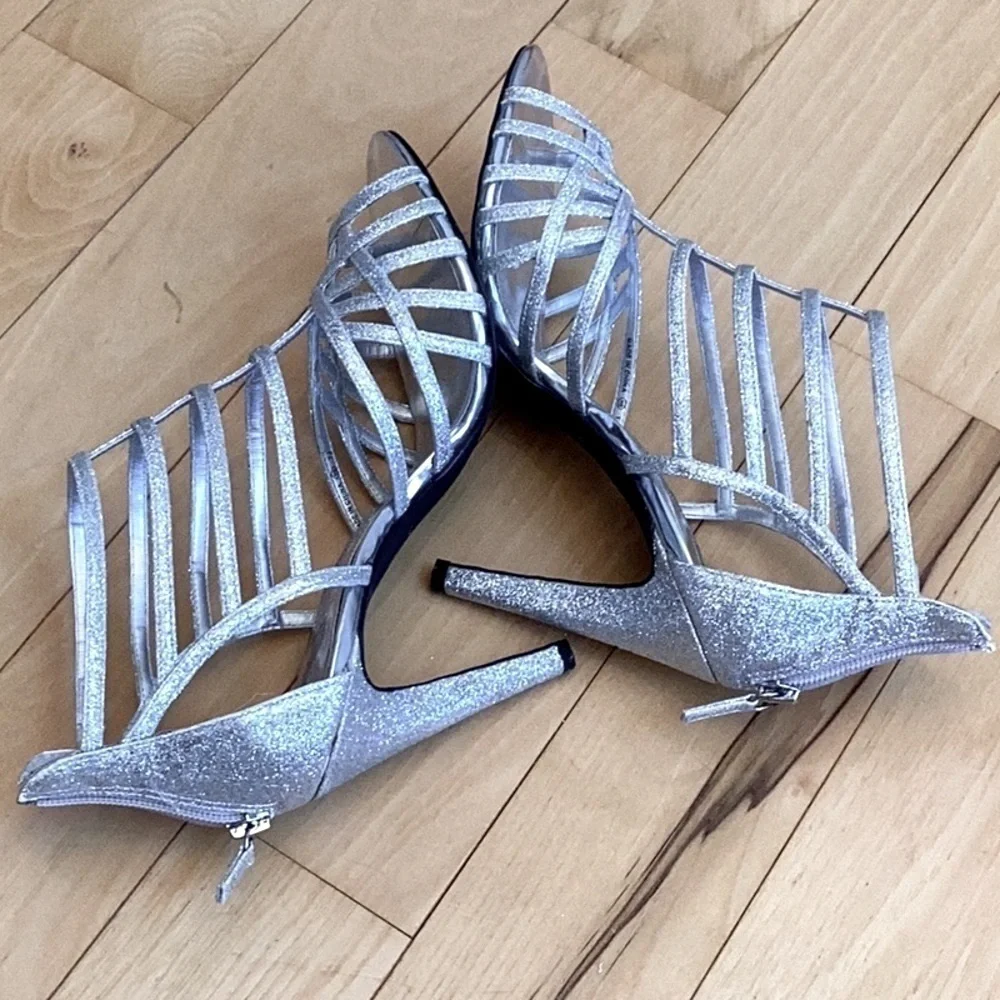 Nina silver glittery, strappy high heels, zipper to back. Women’s size 7